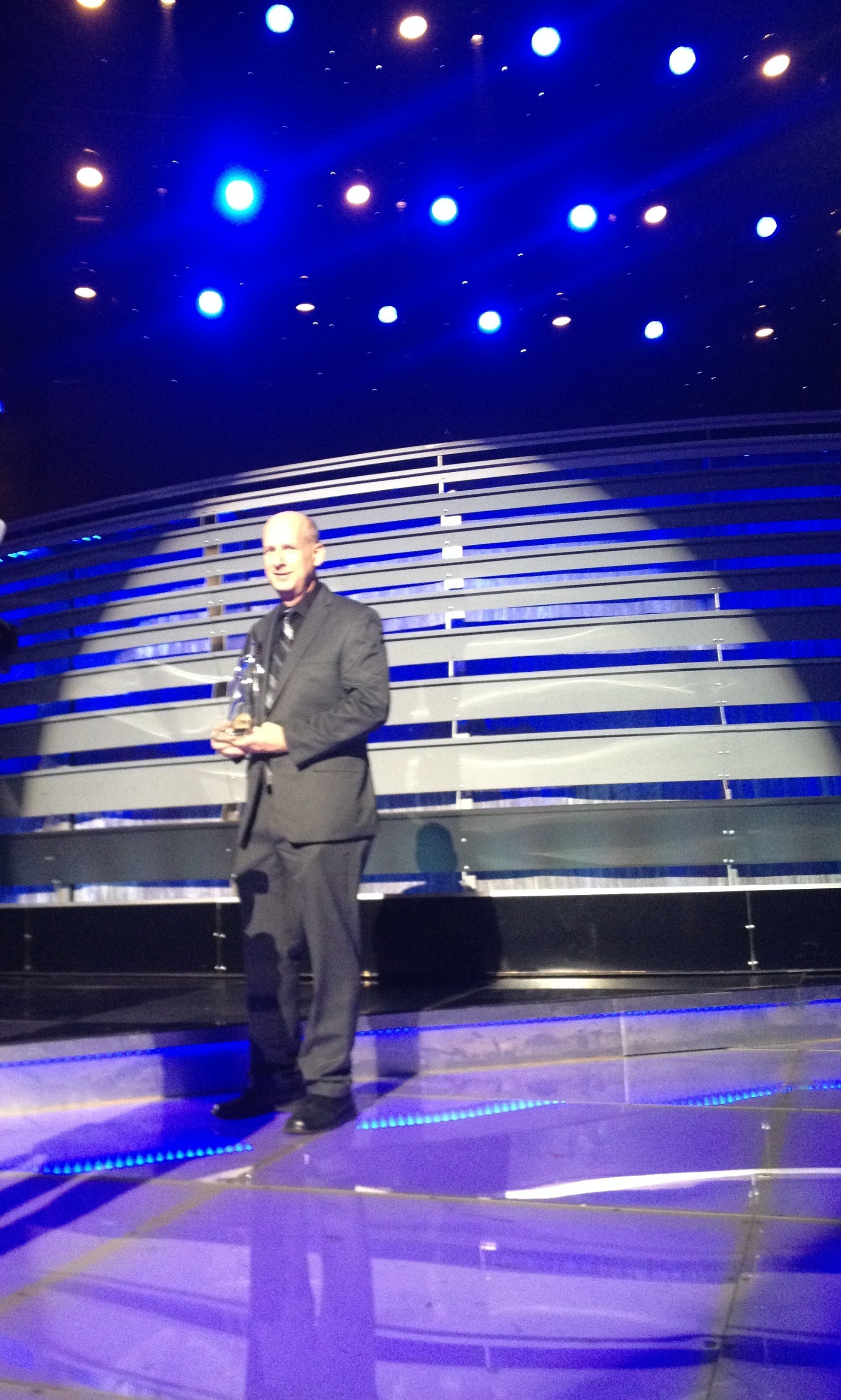 Buzz Jackson on stage accepting a CMA Award
